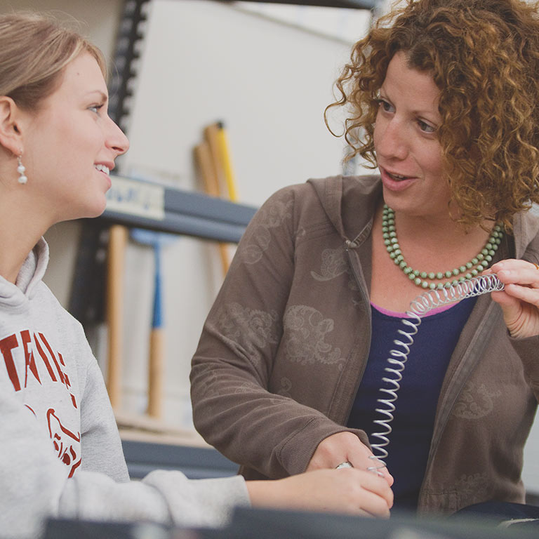 A Herron faculty member talks through a project with her student.