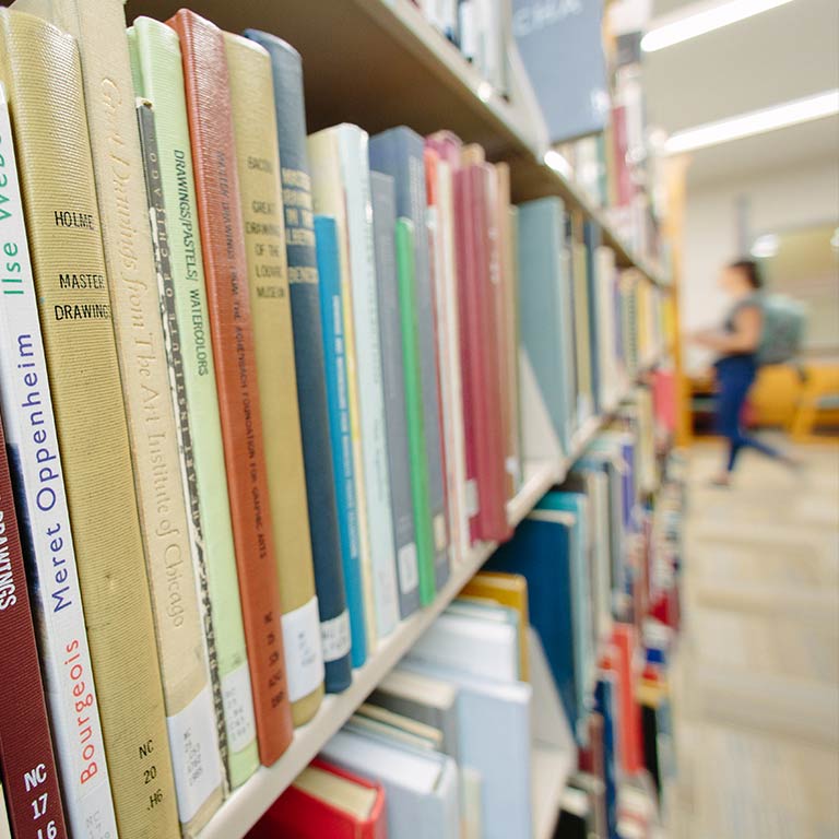 Closeup of bookshelves in the Herron Art Library.