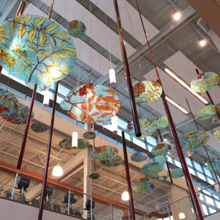 Dozens of colorful discs hang from the ceiling in the atrium of the YMCA.